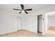 Spacious bedroom with ceiling fan, closet, and light wood flooring at 2802 21St W St, Bradenton, FL 34205