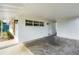 Attached carport with white walls, lights and direct access to home at 2802 21St W St, Bradenton, FL 34205
