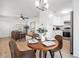 Open-concept dining area connected to a modern living room and kitchen at 2802 21St W St, Bradenton, FL 34205