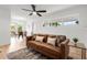 Bright living room featuring neutral walls, ceiling fan, and a dining area view at 2802 21St W St, Bradenton, FL 34205