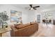 Cozy living room with modern decor, a ceiling fan, and wood-look flooring at 2802 21St W St, Bradenton, FL 34205
