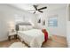 Serene main bedroom featuring a ceiling fan, a cozy bed setup, and ample natural light at 2802 21St W St, Bradenton, FL 34205