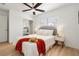 Bright main bedroom with a ceiling fan, a large window, and neutral decor at 2802 21St W St, Bradenton, FL 34205