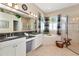 Luxurious bathroom with a soaking tub, separate shower, and stylish decor at 2875 Grazeland Dr, Sarasota, FL 34240