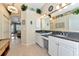 Elegant bathroom with dual sinks, granite countertops, and a large mirror at 2875 Grazeland Dr, Sarasota, FL 34240
