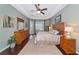 Charming bedroom with tray ceiling, wood floors, and plenty of natural light at 2875 Grazeland Dr, Sarasota, FL 34240