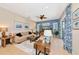Bright living room with comfortable seating, stylish decor, and sliding door access at 2875 Grazeland Dr, Sarasota, FL 34240