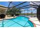 Relax by this beautiful screened-in pool with plenty of room for chairs and entertaining at 2875 Grazeland Dr, Sarasota, FL 34240