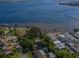 Scenic waterfront neighborhood with beautiful houses, lush trees, and tranquil water views at 305 Chauncey Ave, Bradenton, FL 34208