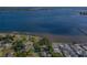 Waterfront community featuring boat docks, mature trees, and picturesque views of the bay at 305 Chauncey Ave, Bradenton, FL 34208