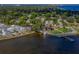 Picturesque waterfront homes with private docks and lush trees overlooking the bay at 305 Chauncey Ave, Bradenton, FL 34208