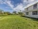 Expansive backyard showing the property line, great for gardening, recreation, or expansion opportunities at 305 Chauncey Ave, Bradenton, FL 34208