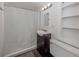 Cozy bathroom featuring a shower with curtain, classic vanity, and toilet at 305 Chauncey Ave, Bradenton, FL 34208