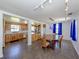View from dining room featuring hardwood table and view to kitchen featuring butcher block island at 305 Chauncey Ave, Bradenton, FL 34208