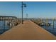 Endless fishing pier perfect for boat docking with beautiful water views beneath clear skies at 305 Chauncey Ave, Bradenton, FL 34208