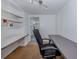 Home office provides built-in shelves, office desk, and natural lighting at 305 Chauncey Ave, Bradenton, FL 34208