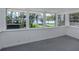 Enclosed patio featuring beautiful views of the water and landscaping at 305 Chauncey Ave, Bradenton, FL 34208