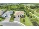 Spacious single-Gathering home from above featuring lush landscaping, a tile roof, a pool, and a paver driveway at 3379 Chestertown Loop, Bradenton, FL 34211