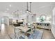 Open-concept layout showcasing dining area, living room, and modern kitchen at 3379 Chestertown Loop, Bradenton, FL 34211