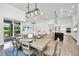 Open-concept layout showcasing dining area, living room, and modern kitchen at 3379 Chestertown Loop, Bradenton, FL 34211