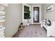 Welcoming front porch with decorative lanterns, a bench, and a view of the front door at 3379 Chestertown Loop, Bradenton, FL 34211