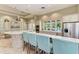 Community kitchen with stainless steel appliances and kitchen island at 3379 Chestertown Loop, Bradenton, FL 34211