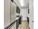 Well-equipped laundry room with stainless steel appliances and plenty of cabinets for storage and organization at 3379 Chestertown Loop, Bradenton, FL 34211