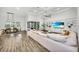 Spacious living room flows into dining area, featuring a built-in entertainment center and sliding glass doors at 3379 Chestertown Loop, Bradenton, FL 34211
