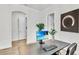 Bright office space with desk, chair, and beach scene on monitor at 3379 Chestertown Loop, Bradenton, FL 34211