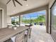 Outdoor patio space with a dining area, lounge chair, and manicured landscaping at 3379 Chestertown Loop, Bradenton, FL 34211