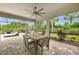 Outdoor patio with a ceiling fan, views of a lush backyard, perfect for dining al fresco at 3379 Chestertown Loop, Bradenton, FL 34211