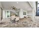 Spacious patio with dining and seating areas, showcasing the seamless indoor-outdoor living at 3379 Chestertown Loop, Bradenton, FL 34211
