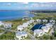 An aerial view of a condo complex and surrounding area, showcasing its waterfront location at 3430 77Th W St # 301, Bradenton, FL 34209