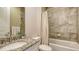 Well-appointed bathroom with tiled walls, tub, and coordinated fixtures at 3430 77Th W St # 301, Bradenton, FL 34209