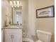 Cozy bathroom with granite countertops, framed art, and soft lighting at 3430 77Th W St # 301, Bradenton, FL 34209