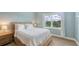 Light-filled bedroom offering a calming retreat with a large window and views of lush greenery at 3430 77Th W St # 301, Bradenton, FL 34209