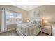Comfortable bedroom with light-colored walls, and wood-style flooring at 3430 77Th W St # 301, Bradenton, FL 34209