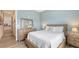 Bright bedroom featuring stylish decor, wood flooring, and a relaxing atmosphere at 3430 77Th W St # 301, Bradenton, FL 34209