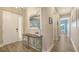 Inviting entryway with decorative table and artwork, leading to bright, open living spaces at 3430 77Th W St # 301, Bradenton, FL 34209