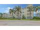 Beautiful multi-story condo complex featuring tropical landscaping and exterior staircases at 3430 77Th W St # 301, Bradenton, FL 34209