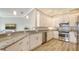 Modern kitchen featuring granite countertops, stainless steel appliances, and bright white cabinetry at 3430 77Th W St # 301, Bradenton, FL 34209