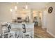 The bright kitchen has breakfast bar seating, granite countertops, stainless steel appliances and pendant lighting at 3430 77Th W St # 301, Bradenton, FL 34209