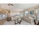 Open-concept living area featuring modern decor, comfortable seating, and view to the kitchen at 3430 77Th W St # 301, Bradenton, FL 34209