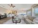 Bright, open living area with modern furnishings and a view of the adjacent kitchen and dining at 3430 77Th W St # 301, Bradenton, FL 34209