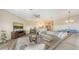 Open-concept living area with view of a modern kitchen and dining space, perfect for entertaining at 3430 77Th W St # 301, Bradenton, FL 34209