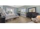 This bedroom has beautiful flooring, a balcony with lots of light, and a full dresser at 3430 77Th W St # 301, Bradenton, FL 34209