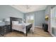 This main bedroom features natural light, hardwood flooring, and a relaxing color scheme at 3430 77Th W St # 301, Bradenton, FL 34209