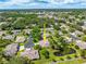 This home features a well-maintained roof, landscaping, a pond, and a private driveway nestled within a lush community at 3530 Wilkinson Woods Dr # 14, Sarasota, FL 34231