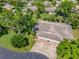 Aerial view of the property showcasing the home's layout, landscaping, and surrounding community at 3530 Wilkinson Woods Dr # 14, Sarasota, FL 34231