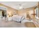 Bedroom featuring neutral decor, plush carpet, and a view to an ensuite bathroom at 3530 Wilkinson Woods Dr # 14, Sarasota, FL 34231